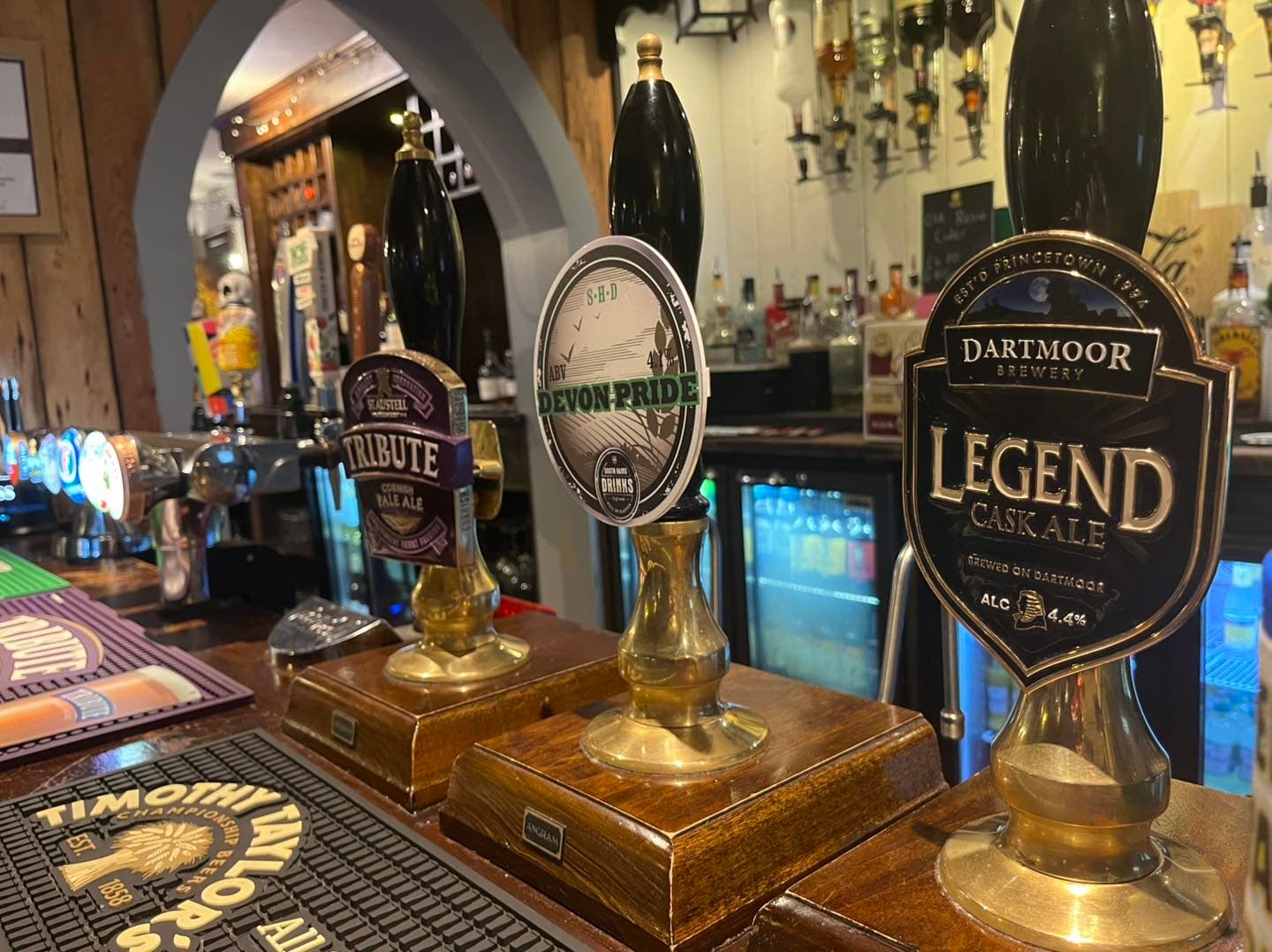 Three real ales pulled at The George's bar — St Austell Tribute, Salcombe Devon Pride and Dartmoor Legend cask ale